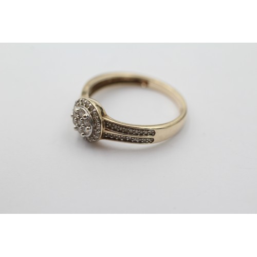 1032 - A 9ct gold diamond halo ring with diamond set shank, size P½ - approx. gross weight 2.5 grams