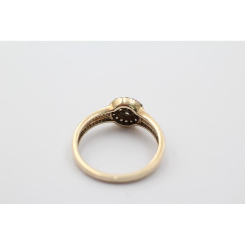 1032 - A 9ct gold diamond halo ring with diamond set shank, size P½ - approx. gross weight 2.5 grams