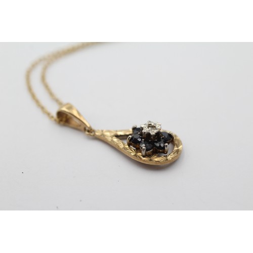 1035 - A 9ct gold diamond and sapphire floral cluster pendant necklace - approx. gross weight 2.5 grams