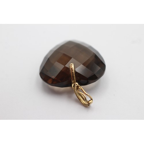 1042 - Two 9ct gold smoky quartz pendants - approx. gross weight 15 grams