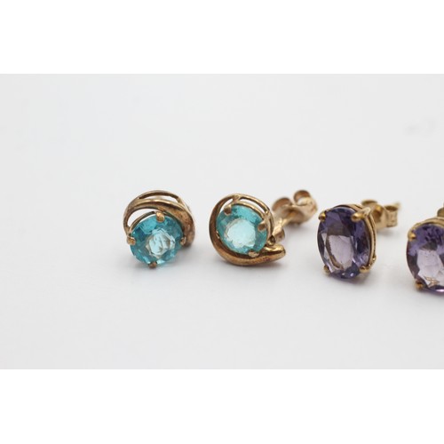 1043 - Three pairs of 9ct gold earrings, one apatite, one amethyst and one fire opal - approx. gross weight... 