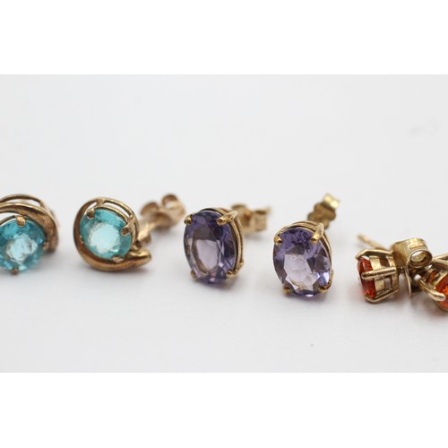 1043 - Three pairs of 9ct gold earrings, one apatite, one amethyst and one fire opal - approx. gross weight... 