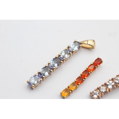 1044 - Three 9ct gold gemstone set pendants, one tanzanite, one goshenite and one fire opal - approx. gross... 