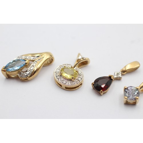 1047 - Four 9ct gold gemstone set pendants, one diamond and garnet, one diamond and yellow gemstone, one di... 