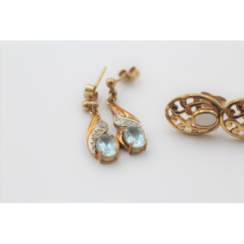 1050 - Three pairs of 9ct gold earrings, two opal and one topaz and diamond - approx. gross weight 4.5 gram... 