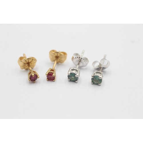 1051 - Two pairs of 9ct gold gemstone stud earrings, one ruby and one blue gemstone - approx. gross weight ... 