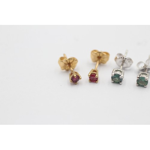 1051 - Two pairs of 9ct gold gemstone stud earrings, one ruby and one blue gemstone - approx. gross weight ... 