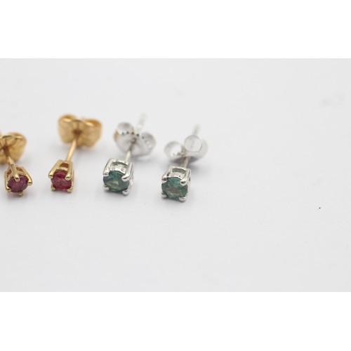 1051 - Two pairs of 9ct gold gemstone stud earrings, one ruby and one blue gemstone - approx. gross weight ... 