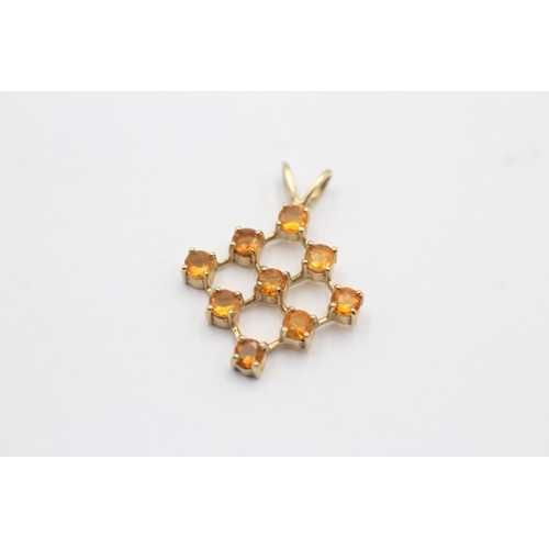 1054 - Two 9ct gold gemstone set pendants, one with diamond - approx. gross weight 2.8 grams