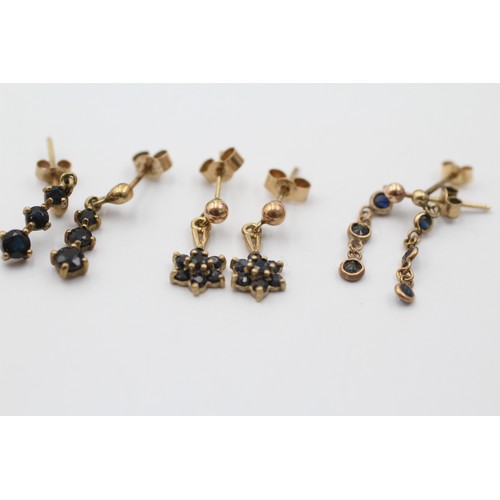 1061 - Three pairs of 9ct gold sapphire earrings - approx. gross weight 2.3 grams