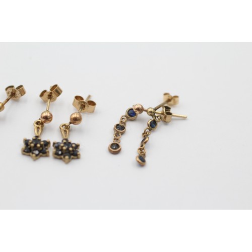 1061 - Three pairs of 9ct gold sapphire earrings - approx. gross weight 2.3 grams