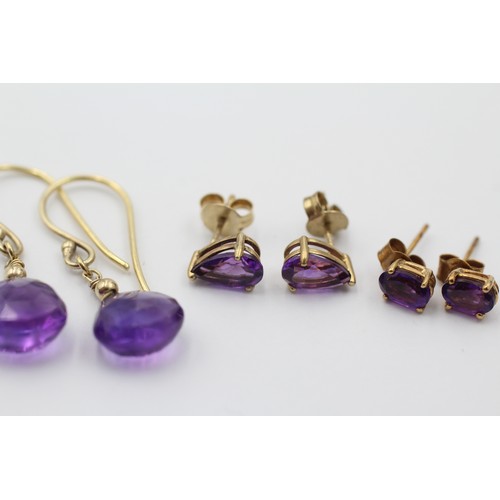 1062 - Three pairs of 9ct gold amethyst earrings - approx. gross weight 4.2 grams