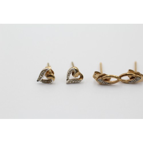 1063 - Three pairs of 9ct gold diamond stud earrings - approx. gross weight 1.6 grams