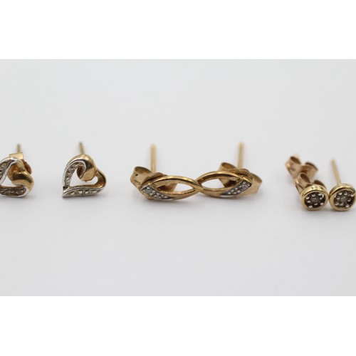 1063 - Three pairs of 9ct gold diamond stud earrings - approx. gross weight 1.6 grams