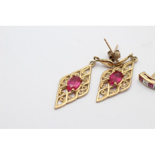 1067 - Two pairs of 9ct gold ruby set earrings, one with diamond - approx. gross weight 3 grams