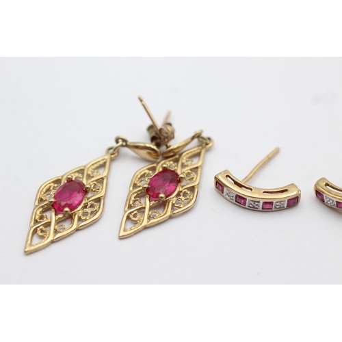 1067 - Two pairs of 9ct gold ruby set earrings, one with diamond - approx. gross weight 3 grams