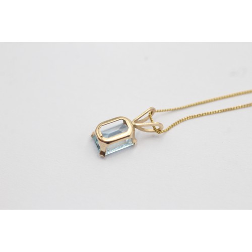 1071 - A 9ct gold topaz single stone pendant necklace - approx. gross weight 0.8 grams