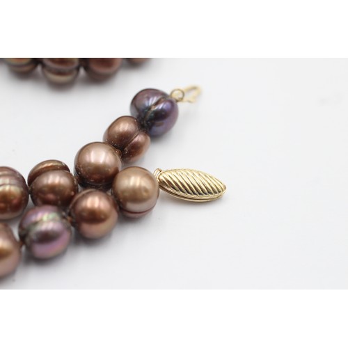 1075 - A 14ct gold clasp brown cultured pearl single strand necklace - approx. gross weight 54.5 grams