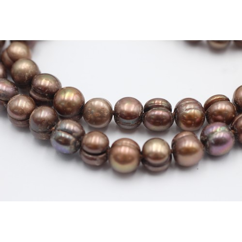 1075 - A 14ct gold clasp brown cultured pearl single strand necklace - approx. gross weight 54.5 grams