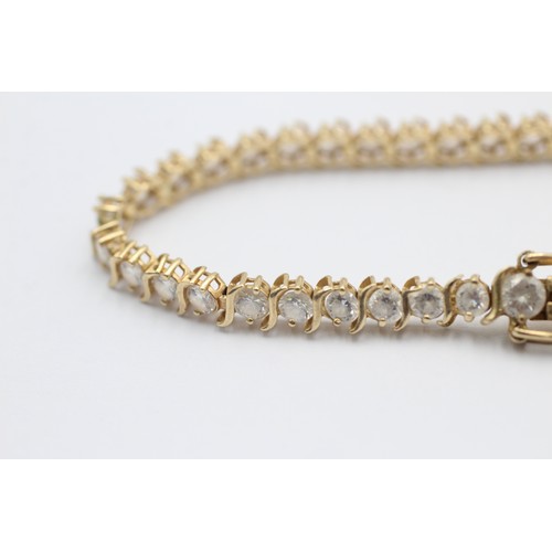 1076 - A 14ct gold clear gemstone tennis bracelet - approx. gross weight 9.3 grams