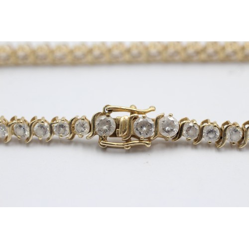 1076 - A 14ct gold clear gemstone tennis bracelet - approx. gross weight 9.3 grams