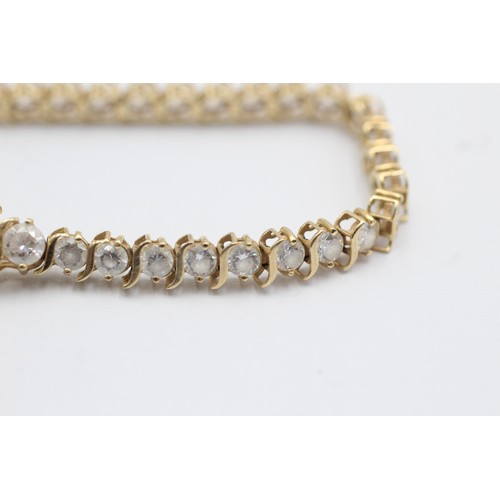 1076 - A 14ct gold clear gemstone tennis bracelet - approx. gross weight 9.3 grams