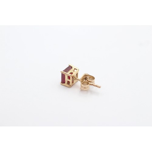 1086 - A pair of 9ct gold ruby stud earrings - approx. gross weight 1.4 grams