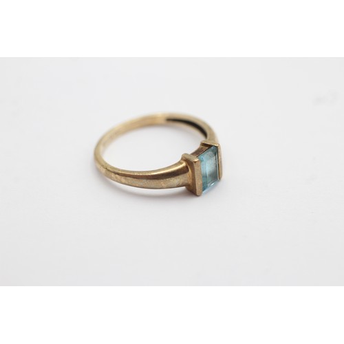 1090 - A 9ct gold baguette cut topaz solitaire ring, size L½ - approx. gross weight 1.6 grams