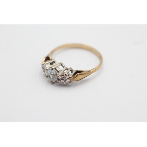 1091 - A 9ct gold diamond and aquamarine three stone ring, size L½ - approx. gross weight 1.7 grams