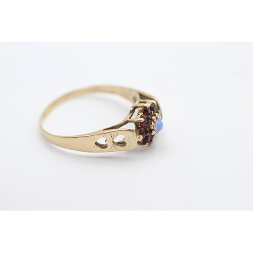 1093 - A 9ct gold garnet and opal halo ring with heart shape shank, size T - approx. gross weight 2 grams