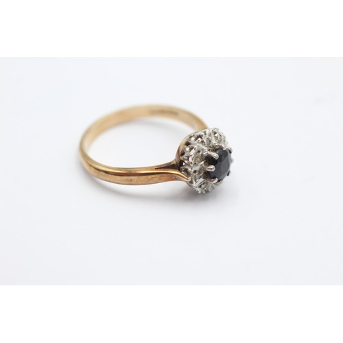 1094 - A 9ct gold diamond and sapphire halo ring, size N - approx. gross weight 2.8 grams