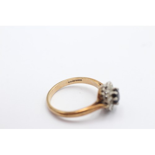 1094 - A 9ct gold diamond and sapphire halo ring, size N - approx. gross weight 2.8 grams