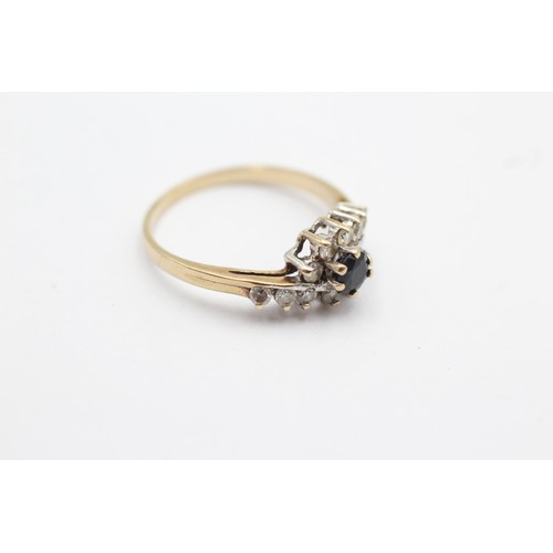 1096 - A 9ct gold sapphire and clear gemstone dress ring, size M - approx. gross weight 1.8 grams