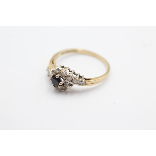 1096 - A 9ct gold sapphire and clear gemstone dress ring, size M - approx. gross weight 1.8 grams