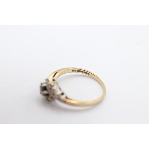 1096 - A 9ct gold sapphire and clear gemstone dress ring, size M - approx. gross weight 1.8 grams