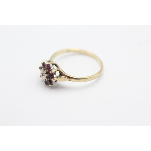 1103 - A 9ct gold diamond and ruby floral cluster ring, size K½ - approx. gross weight 1.4 grams