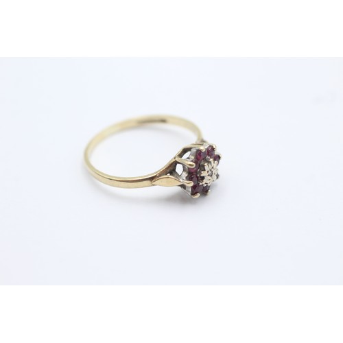 1103 - A 9ct gold diamond and ruby floral cluster ring, size K½ - approx. gross weight 1.4 grams