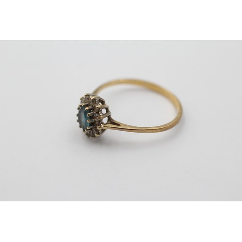 1107 - A 9ct gold topaz and clear gemstone halo ring, size K - approx. gross weight 1.1 grams