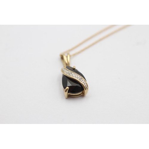 1108 - A 9ct gold diamond and sapphire teardrop pendant necklace - approx. gross weight 2.1 grams