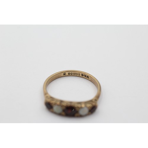 1109 - A 9ct gold garnet and opal five stone ring, size P - approx. gross weight 2.5