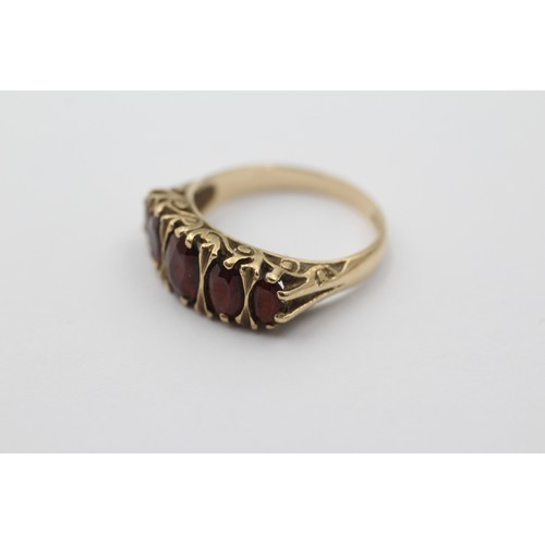 1112 - A 9ct gold garnet five stone ring, size O - approx. gross weight 3.6 grams