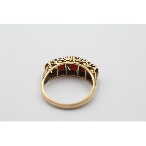 1112 - A 9ct gold garnet five stone ring, size O - approx. gross weight 3.6 grams