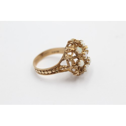 1115 - A 9ct gold opal dress ring with openwork detail, size M½ - approx. gross weight 4.2 grams