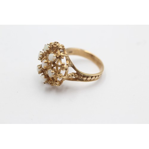 1115 - A 9ct gold opal dress ring with openwork detail, size M½ - approx. gross weight 4.2 grams