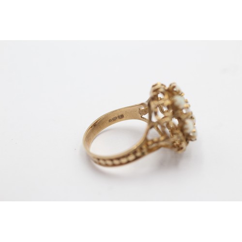 1115 - A 9ct gold opal dress ring with openwork detail, size M½ - approx. gross weight 4.2 grams