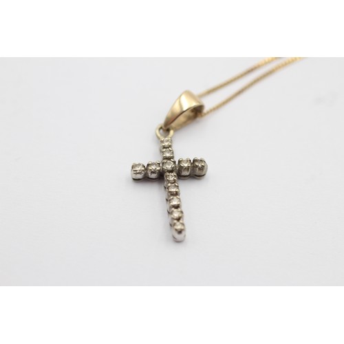 1117 - A 9ct gold diamond cross pendant necklace - approx. gross weight 1.6 grams and necklace 23cm long