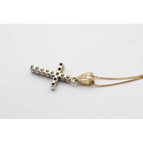 1117 - A 9ct gold diamond cross pendant necklace - approx. gross weight 1.6 grams and necklace 23cm long