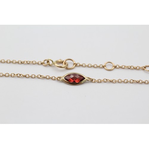 1121 - A 9ct gold marquise cut garnet bracelet - approx. gross weight 0.8 grams