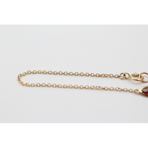 1121 - A 9ct gold marquise cut garnet bracelet - approx. gross weight 0.8 grams