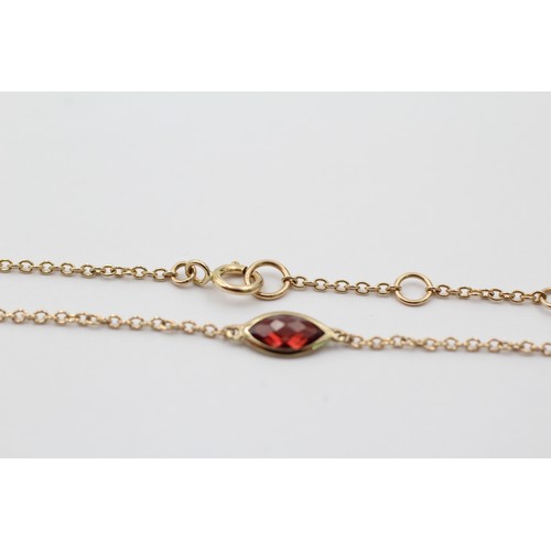 1121 - A 9ct gold marquise cut garnet bracelet - approx. gross weight 0.8 grams